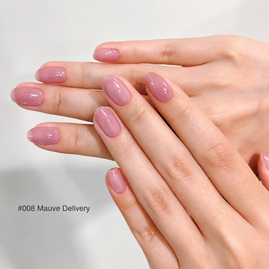 Mauve Delivery mauve pink glossy nail color gel manicure on overlapping hands