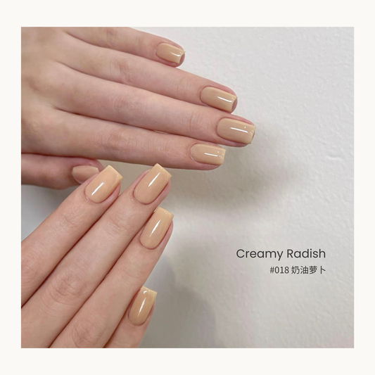 Creamy Radish nail color gel manicure on overlapping hands