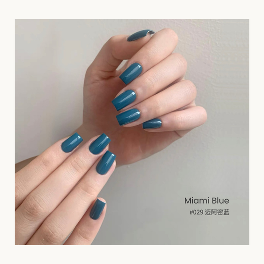Miami blue gel nail polish manicure on two hands