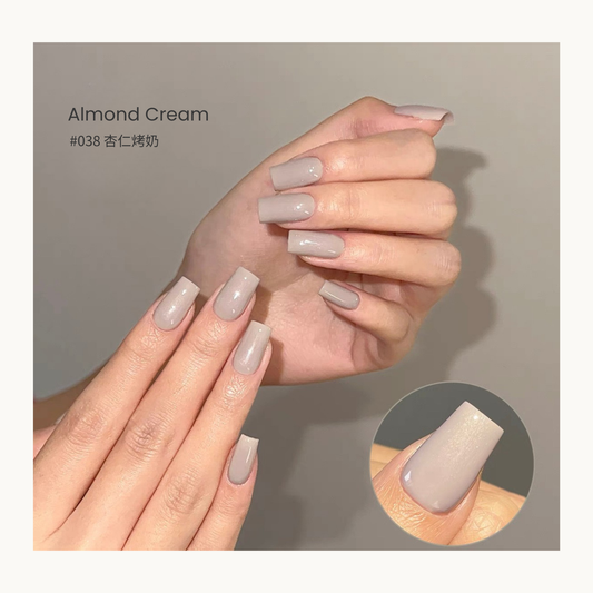 Almond Cream gel nail polish manicure with a glossy pale beige finish