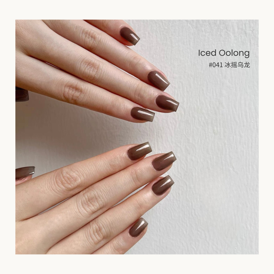 Iced Oolong nail color gel manicure on two sets of hands