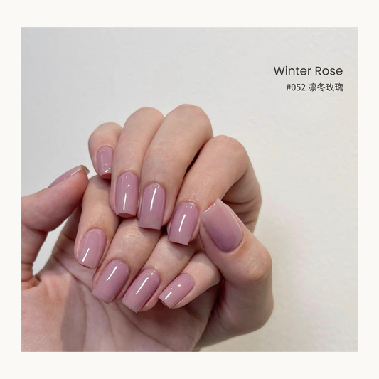 Winter Rose nail color gel manicure in a curved hand pose