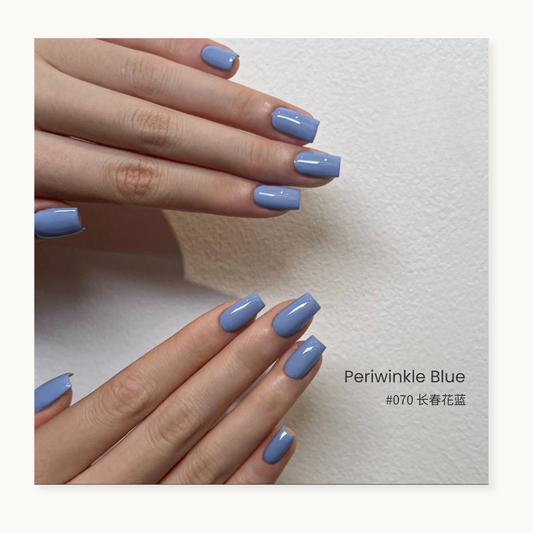 Periwinkle blue gel nail polish manicure on two hands
