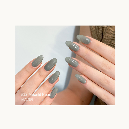 Sheer cool gray gel manicure with a pearly finish