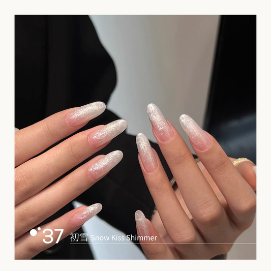 Q37 Snow Kiss Shimmer builder gel finish displayed on long glitter nails