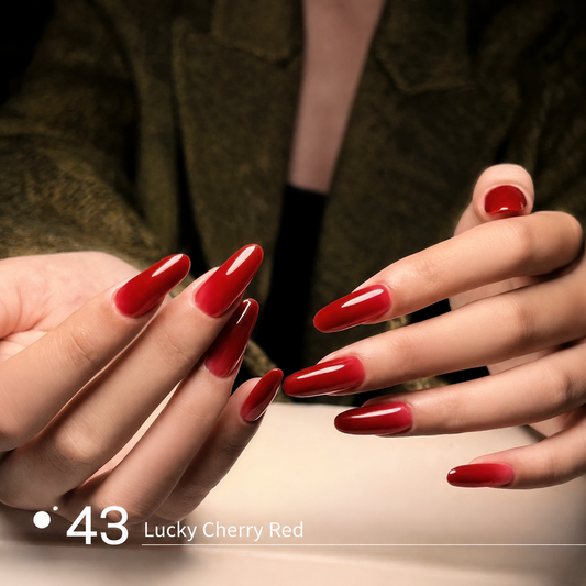 Lucky cherry red builder gel manicure on long glossy nail extensions