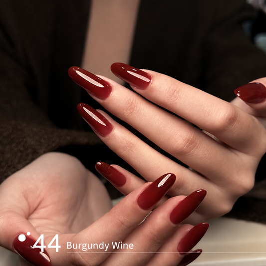 Burgundy wine builder gel manicure on long glossy nail extensions