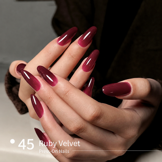 Ruby velvet red builder gel manicure on long glossy nail extensions
