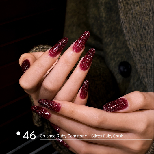 Ruby red glitter builder gel manicure on long nail extensions