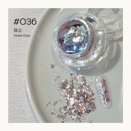 Violet-silver iridescent nail art flakes in a jar with a decorated nail swatch