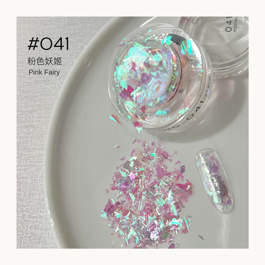 Pink and aqua iridescent nail art flakes in a jar with a decorated swatch