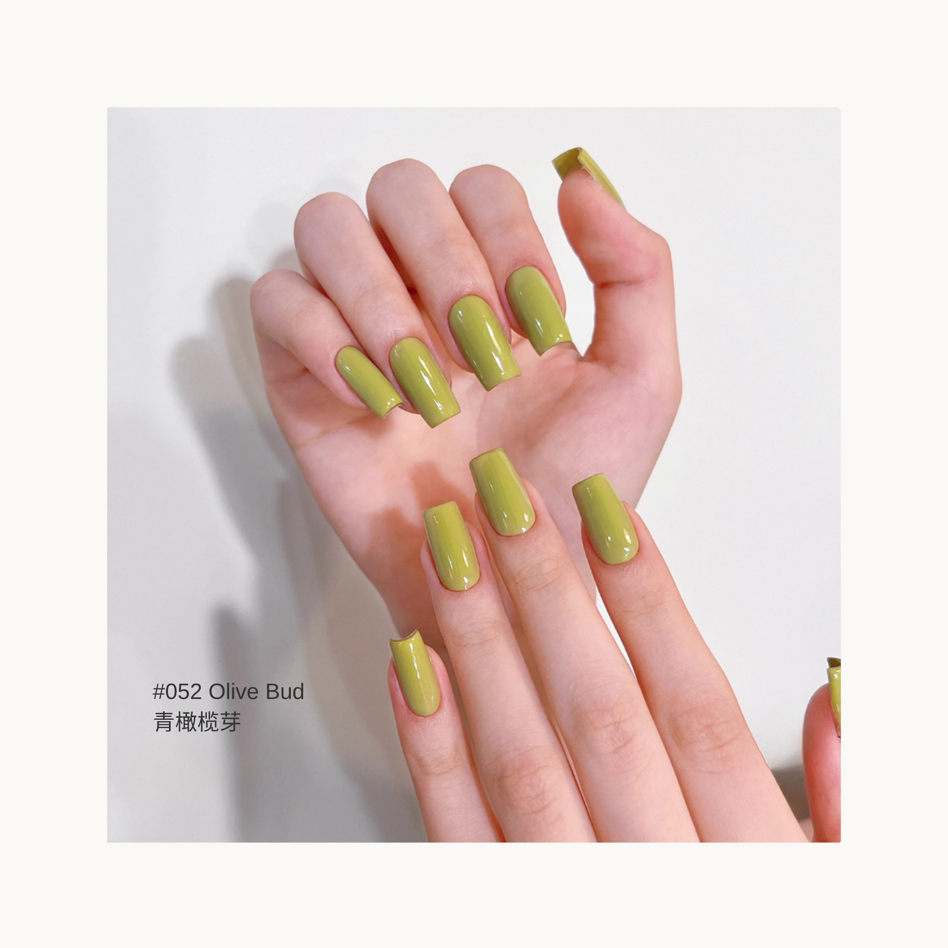 MODING M052 Olive Bud fresh olive green nail polish on model hands