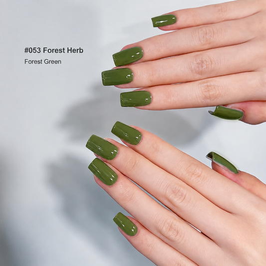 Glossy herb green nail color gel manicure on overlapping hands