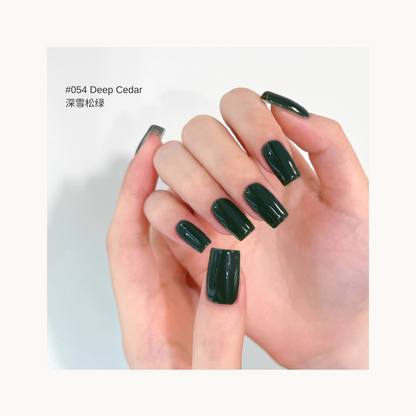 MODING M054 Deep Cedar almost-black cedar green nail polish on hands