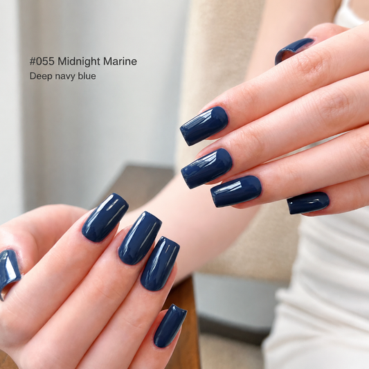 Glossy navy blue nail color gel manicure on overlapping hands