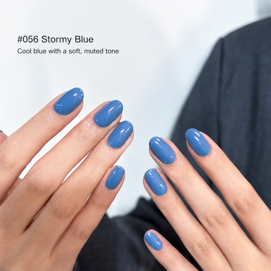 Glossy cloudy blue nail color gel manicure on two hands
