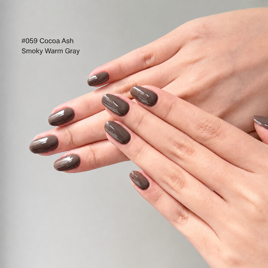 Glossy cocoa-gray nail color gel manicure on overlapping hands
