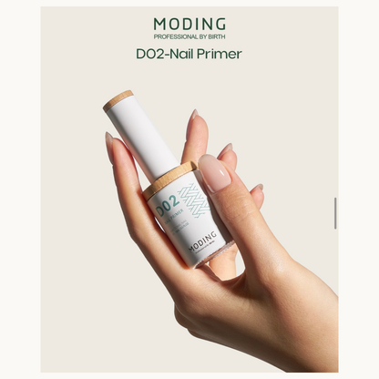 Close-up of a hand holding the Moding Professional D02 Nail Primer bottle, highlighting the sleek packaging and branding for professional nail care.