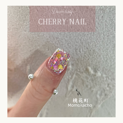 Macro view of Momokacho sparkling pink nail art glitter with iridescent flakes.