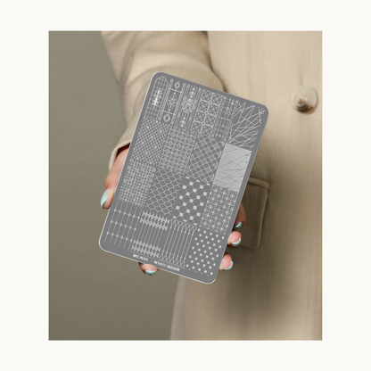 Hand holding MR NAIL W1022 geometric nail stamping plate showcasing detailed pattern engravings