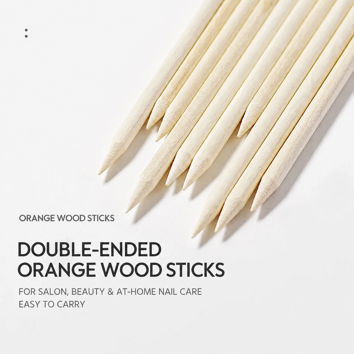 Close-up of double-ended orange wood sticks for salon, beauty and at-home nail care