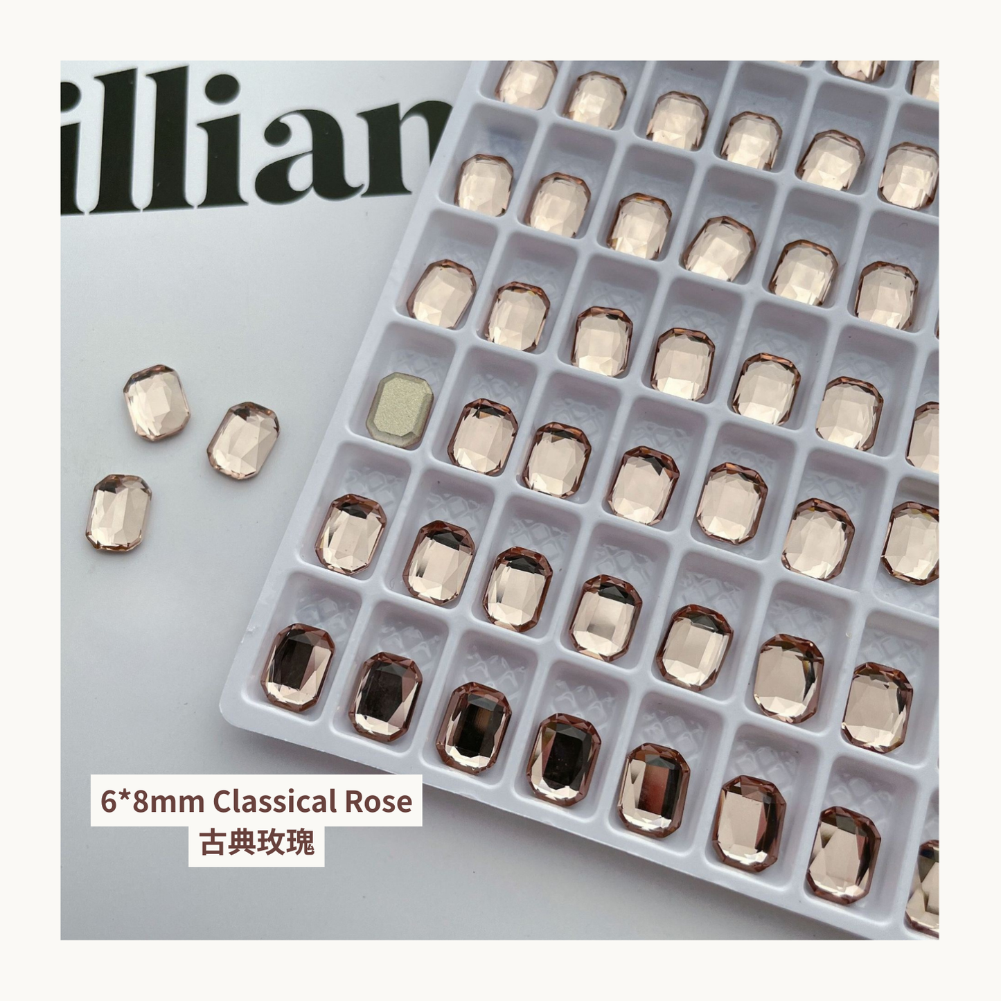 Clear octagon K9 flat back rhinestones classical rose 6x8mm shown on tray and single piece for nail art use
