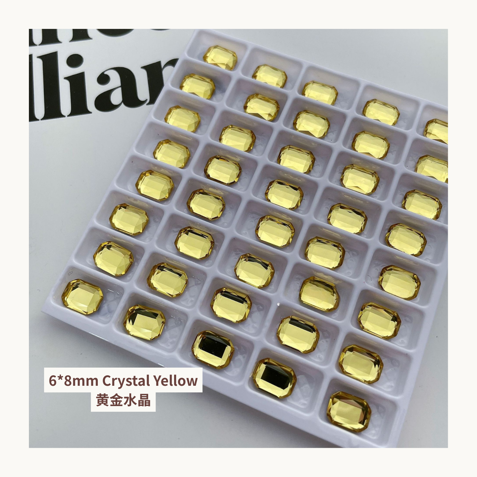 Clear octagon K9 flat back rhinestones crystal yellow 6x8mm shown on tray and single piece for nail art use