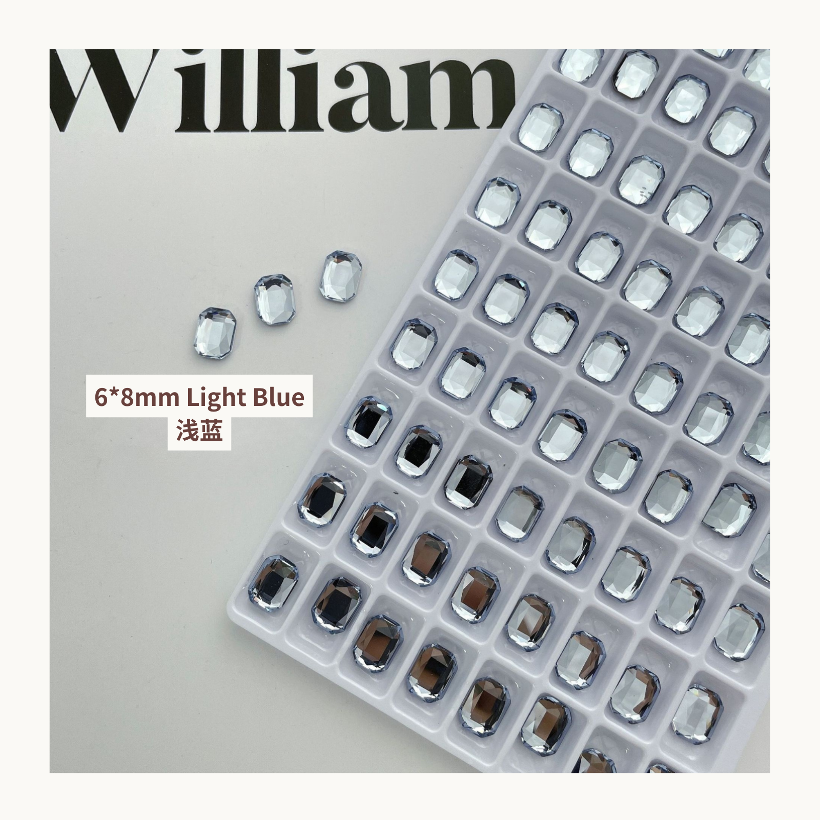 Clear octagon K9 flat back rhinestones light blue 6x8mm shown on tray and single piece for nail art use