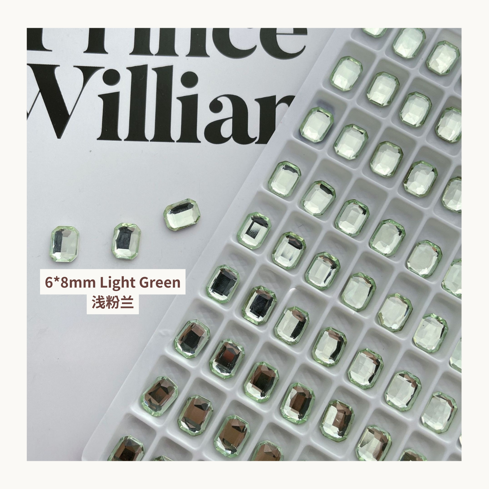 Clear octagon K9 flat back rhinestones light green 6x8mm shown on tray and single piece for nail art use