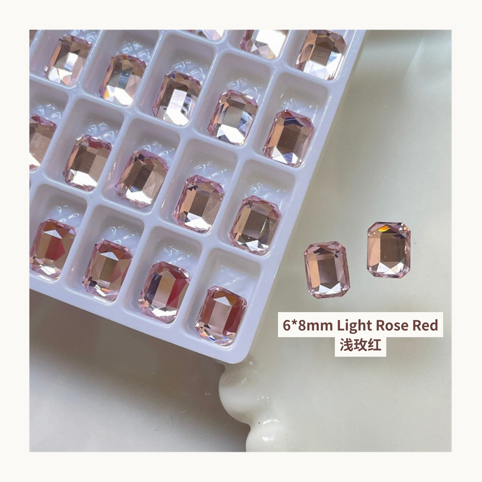 Clear octagon K9 flat back rhinestones light rose red 6x8mm shown on tray and single piece for nail art use
