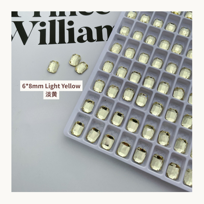 Clear octagon K9 flat back rhinestones light yellow 6x8mm shown on tray and single piece for nail art use