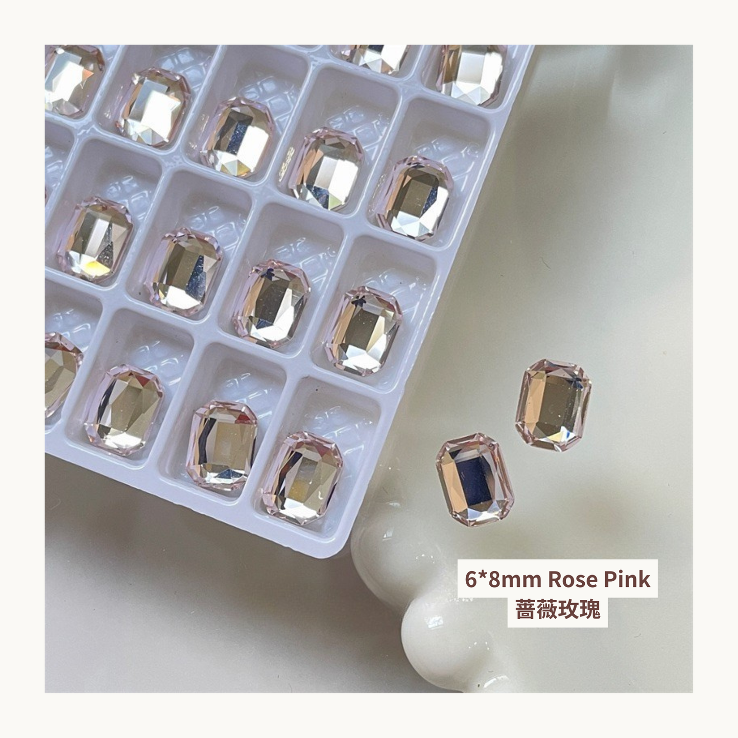 Clear octagon K9 flat back rhinestones Rose Pink 6x8mm shown on tray and single piece for nail art use