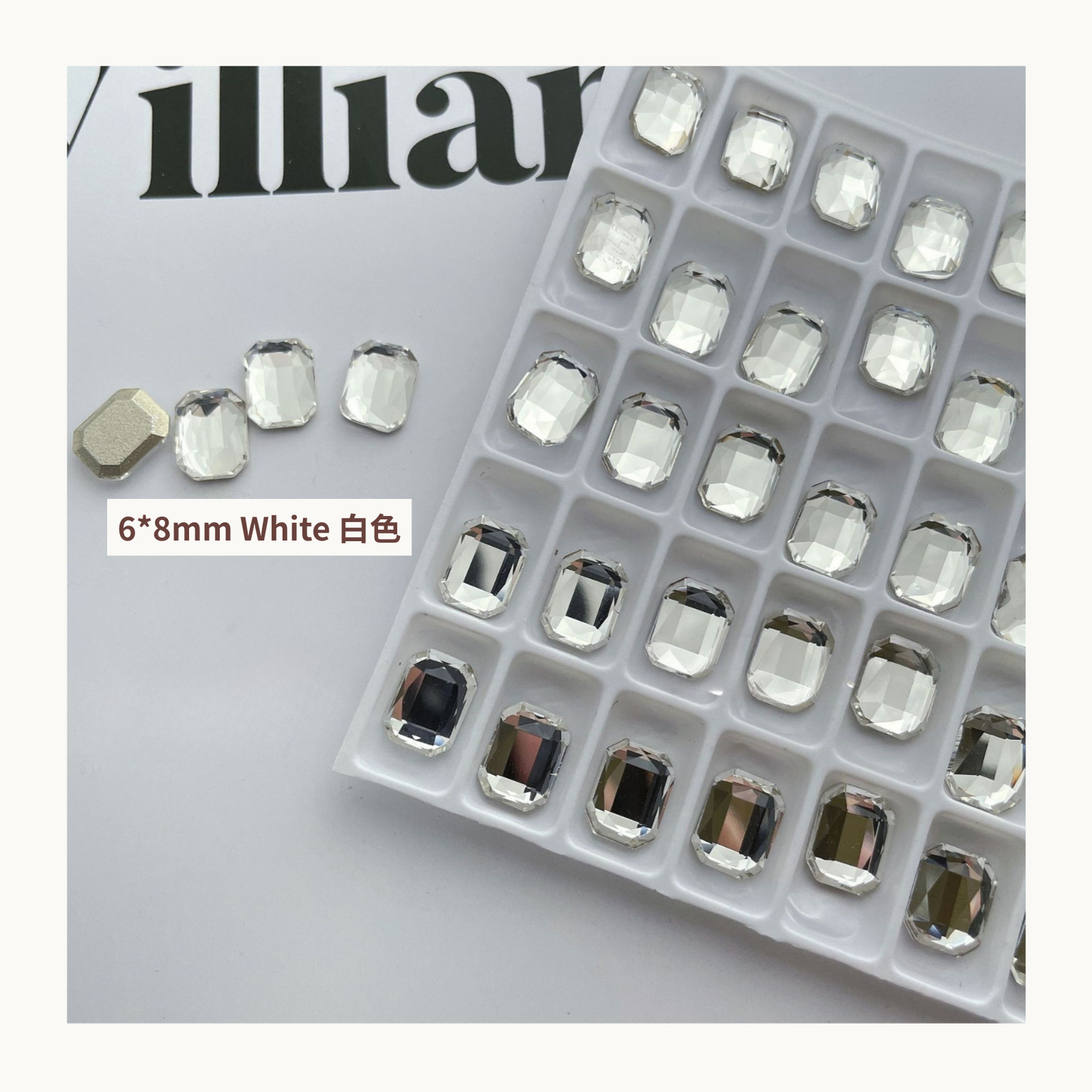 Clear octagon K9 flat back rhinestones white 6x8mm shown on tray and single piece for nail art use