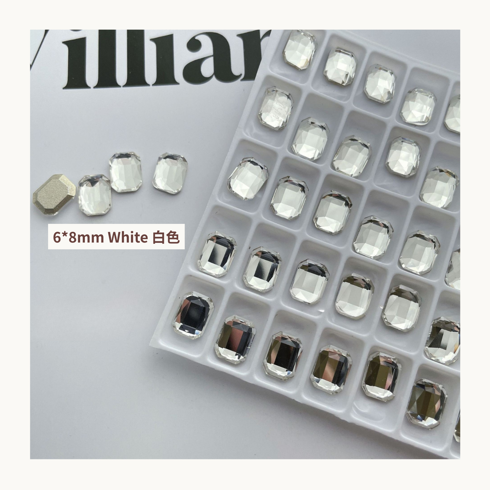 Clear octagon K9 flat back rhinestones white 6x8mm shown on tray and single piece for nail art use