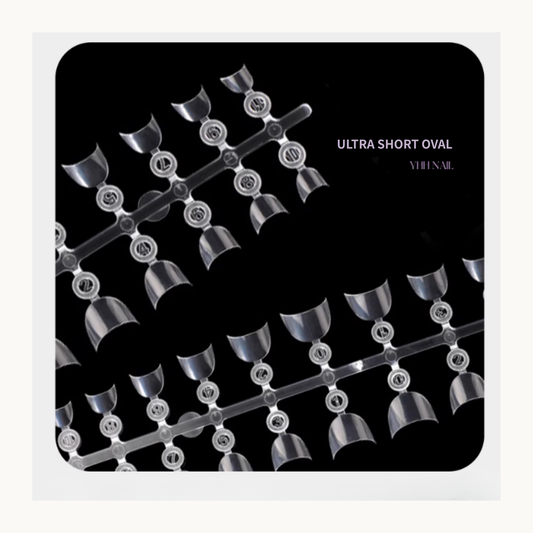 Ultra short oval clear nail tips arranged on numbered display strips