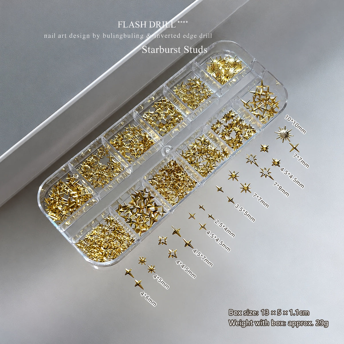 NF x Gold Starbust Studs in a clear 12-grid box, with assorted gold-tone star nail decorations and individual size labels.