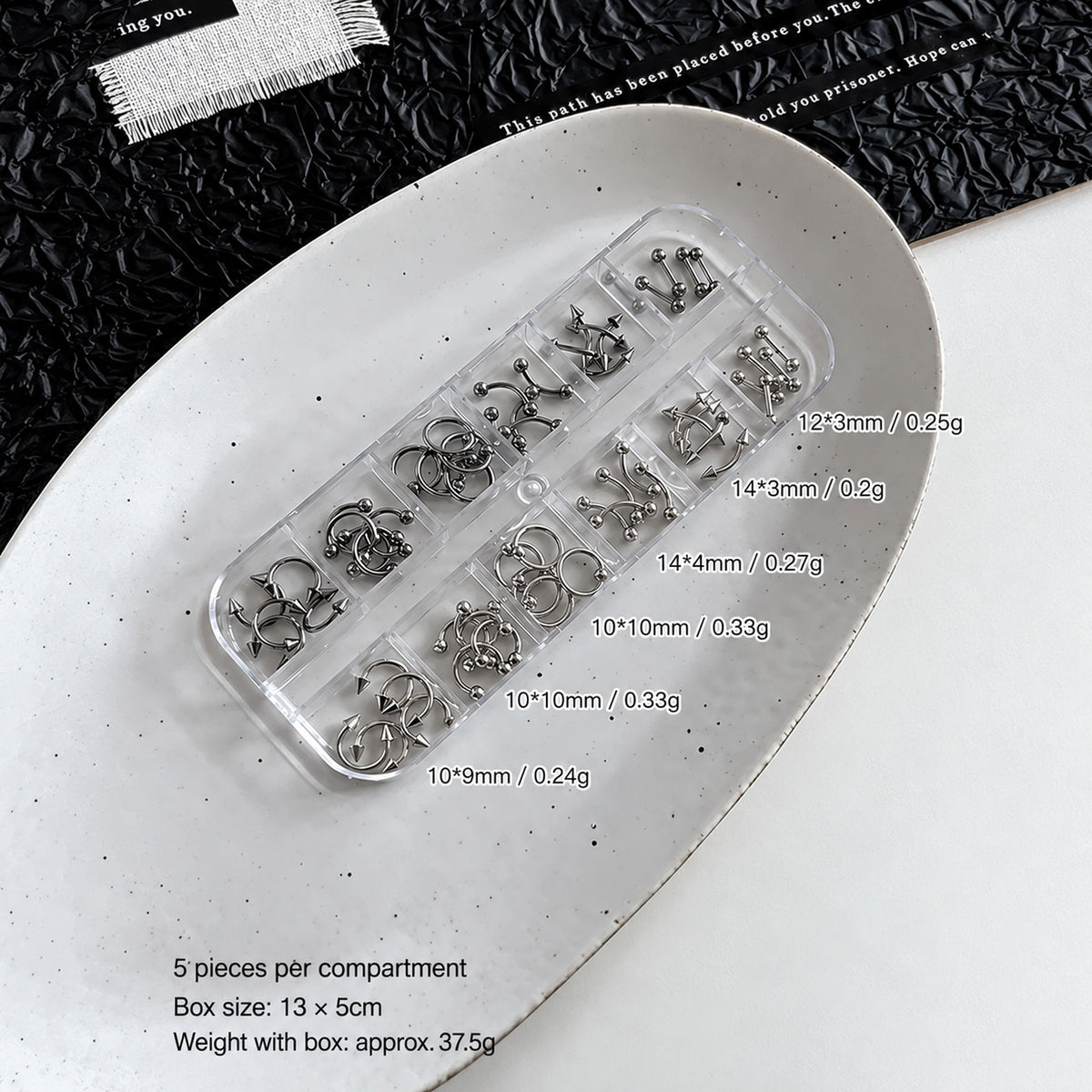 NF x Punk Metal Piercing Charms 12-grid mixed set with size labels, 60 pieces and a clear storage box measuring approximately 13 by 5cm.