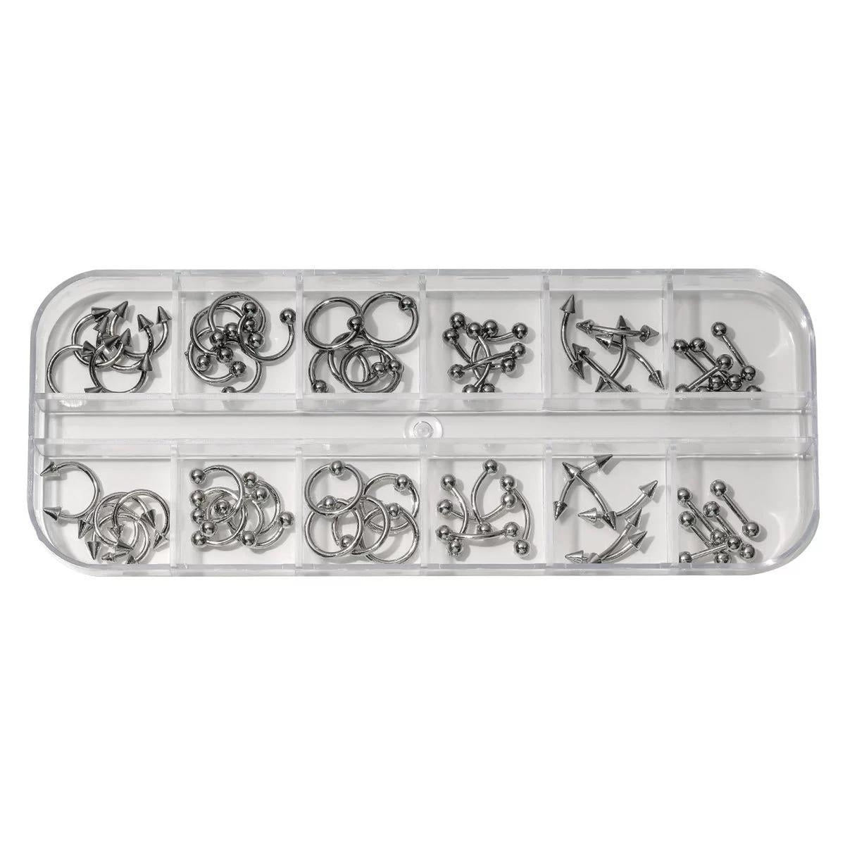 NF x Punk Metal Piercing Charms in a clear 12-grid organizer, with mixed silver-tone and gunmetal rings and barbell designs.