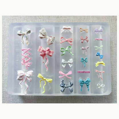 NF Select Bow Nail Mold finished pieces, handmade 3D ribbon bow nail charms in different sizes and designs for cute manicures