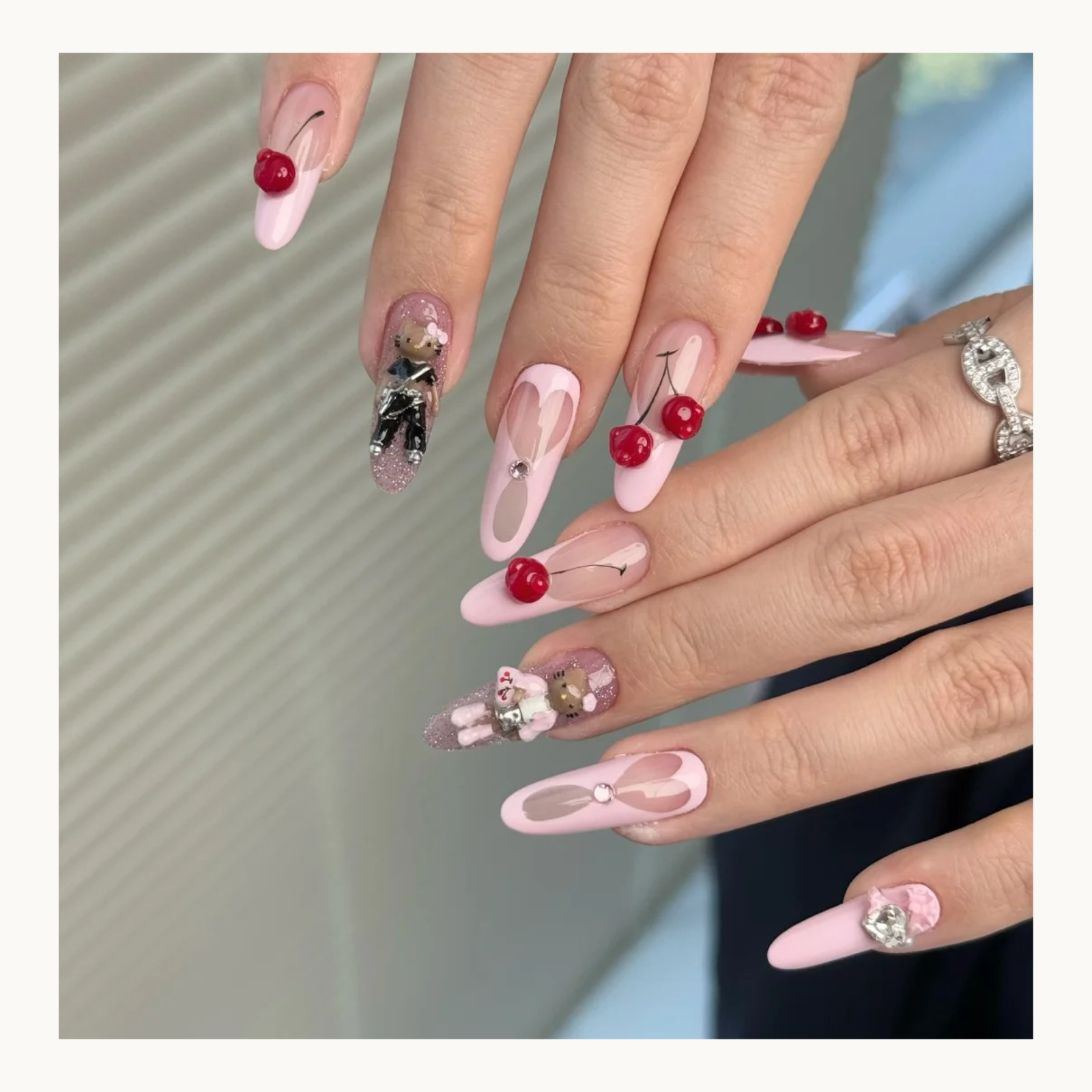 NF Select Cherry Nail Mold application, showing finished 3D cherry nail charms on pink coquette-style manicures