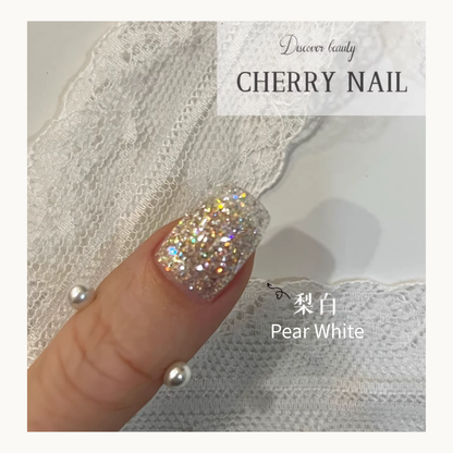 Pear White glitter applied on a nail, showing a sophisticated, fine white iridescent shimmer like crushed pearls.