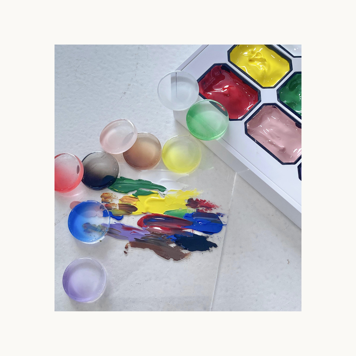 Multi-color gel palette with loose swatches and mixed color samples