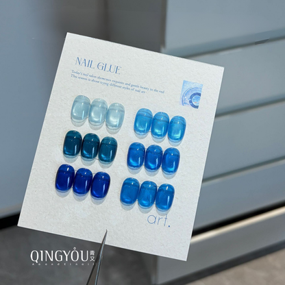 QINGYOU blue gel polish color swatches on a nail art display card
