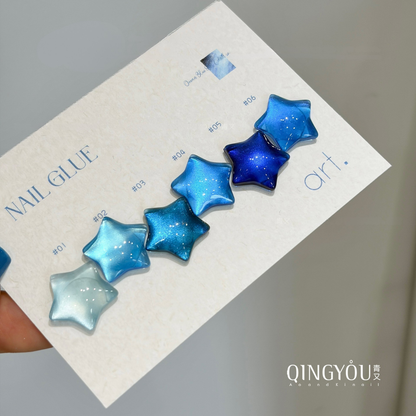 Six blue QINGYOU gel polish shades displayed on star-shaped swatches