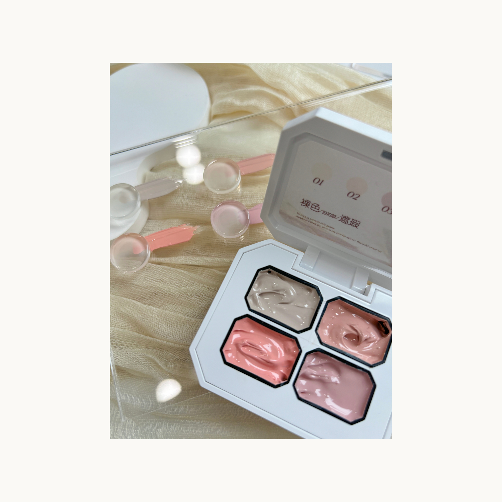 Nude gradient nail art created with QINGYOU 4-grid concealer gel, displayed on clear boards