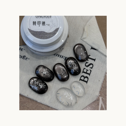 Metallic grey nails with artistic silver stamped designs using QingYou silver transfer paste.