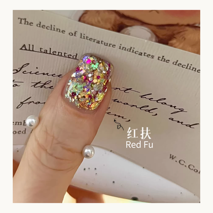Red Fu glitter applied on a nail, highlighting the intense sparkle and variety of flake sizes.