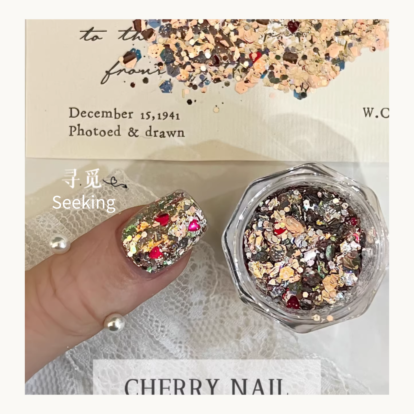 Close-up of Seeking glitter on a nail, showing the romantic red heart accents mixed with fine silver shimmer.