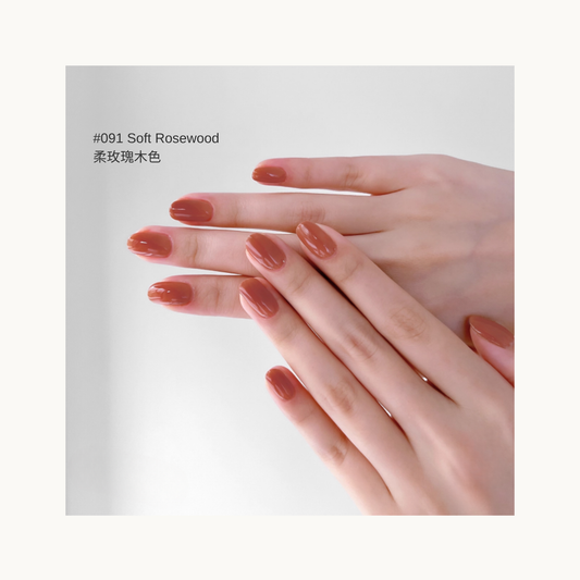 Soft rosewood pink-brown gel manicure on overlapping hands