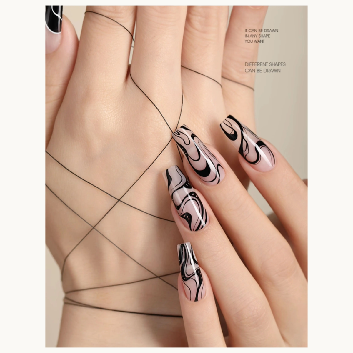Black-and-white abstract line nail art displayed on a hand